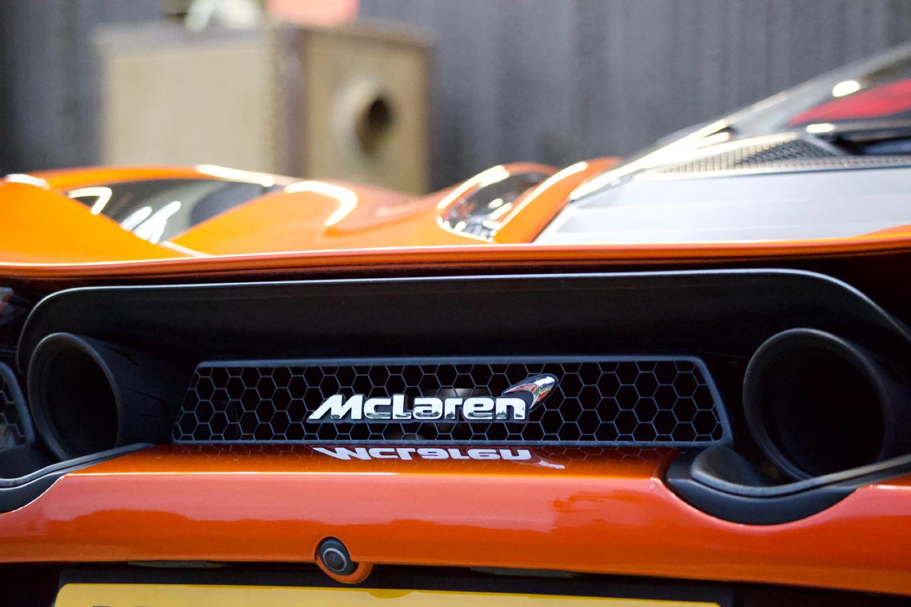 Close view of a McLaren rear exhaust and badge